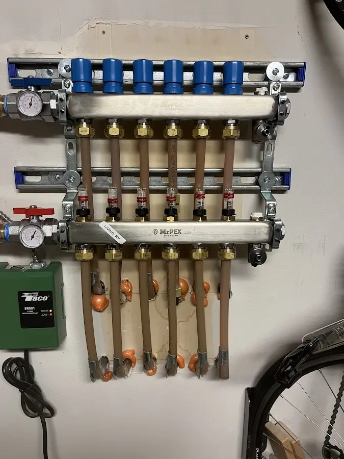 Plumber performing Leak Detection at a residential property in Pella